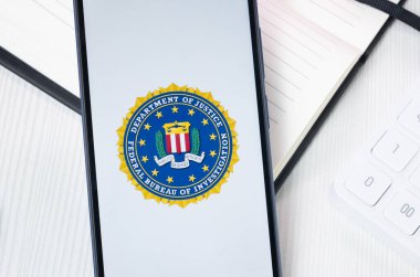 New York, USA - 30 June 2024: Federal Bureau of Investigation FBI Department of Justice Logo or Icon on Phone Screen. clipart