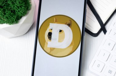 New York, USA - 1 August 2024: Dogecoin DOGE Logo on Phone Screen, Crypto Coin Icon. clipart