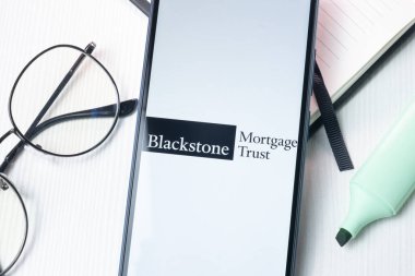 New York, USA - 1 August 2024: Blackstone Mortgage Trust Logo on Phone Screen, Company Icon on Display. clipart