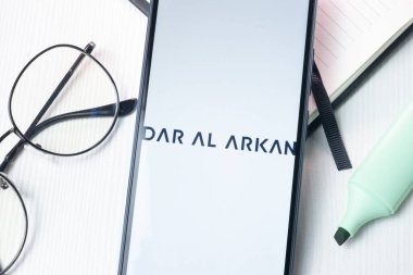 New York, USA - 1 August 2024: Dar Al Arkan Real Estate Development Logo on Phone Screen, Company Icon on Display. clipart