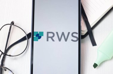 New York, USA - 1 August 2024: RWS Holdings Logo on Phone Screen, Company Icon on Display. clipart