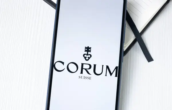 stock image New York, USA - 1 August 2024: Corum Logo on Phone Screen, Company Icon on Display.