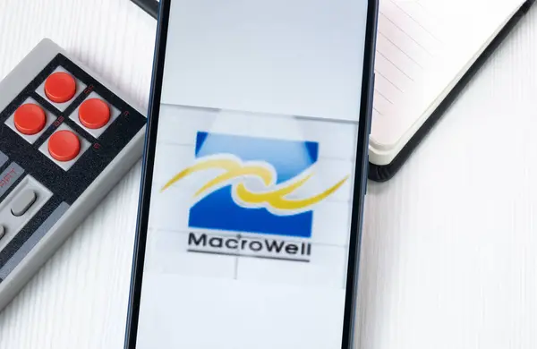 stock image New York, USA - 1 August 2024: MacroWell OMG Digital Entertainment Logo on Phone Screen, Company Icon on Display.