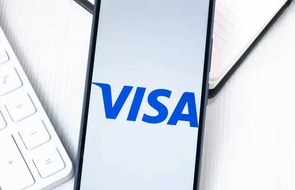 stock image New York, USA - 1 August 2024: Visa Logo on Phone Screen, Company Icon on Display.