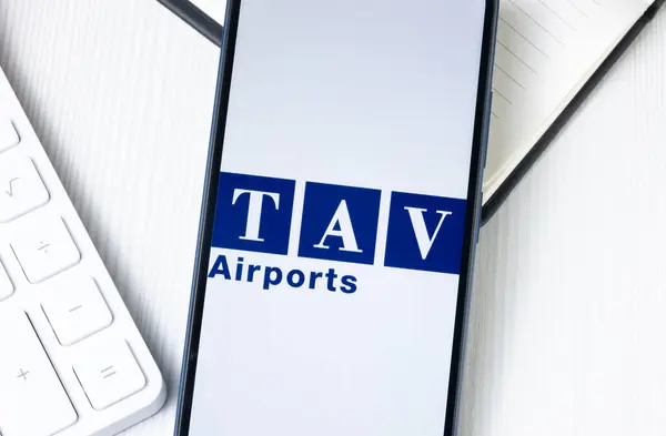 stock image New York, USA - 1 August 2024: TAV Airports Holding Logo on Phone Screen, Company Icon on Display.