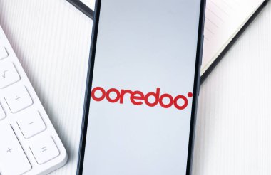 New York, USA - 1 August 2024: Ooredoo Logo on Phone Screen, Company Icon on Display. clipart