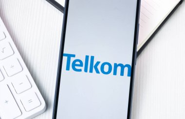 New York, USA - 1 August 2024: Telkom Logo on Phone Screen, Company Icon on Display. clipart