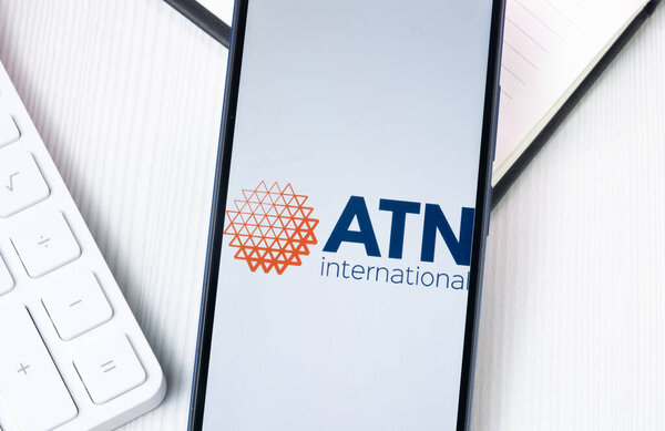 New York, USA - 1 August 2024: ATN International Logo on Phone Screen, Company Icon on Display.