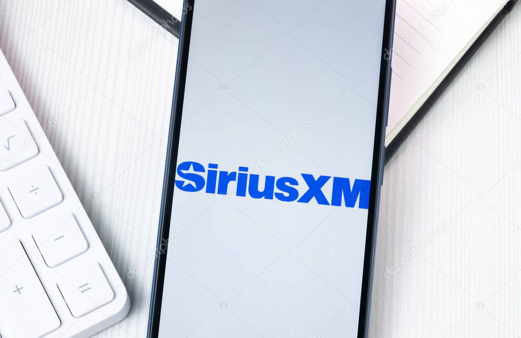 New York, USA - 1 August 2024: Sirius XM Logo on Phone Screen, Company Icon on Display.