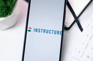 New York, USA - 10 August 2024: Instructure Holdings Logo on Phone Screen, Company Icon on Display. clipart