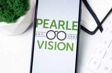 New York, USA - 1 August 2024: Pearle Vision Logo on Phone Screen, Company Icon on Display. clipart