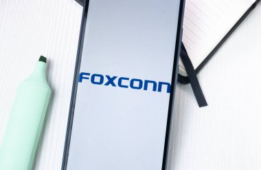 New York, USA - 1 August 2024: Foxconn Hon Hai Precision Industry Logo on Phone Screen, Company Icon on Display. clipart