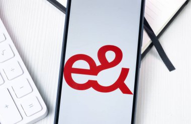 New York, USA - 1 August 2024: Emirates Telecom Etisalat Group Logo on Phone Screen, Company Icon on Display. clipart