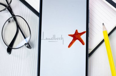 New York, USA - 1 August 2024: Lundbeck Logo on Phone Screen, Company Icon on Display. clipart