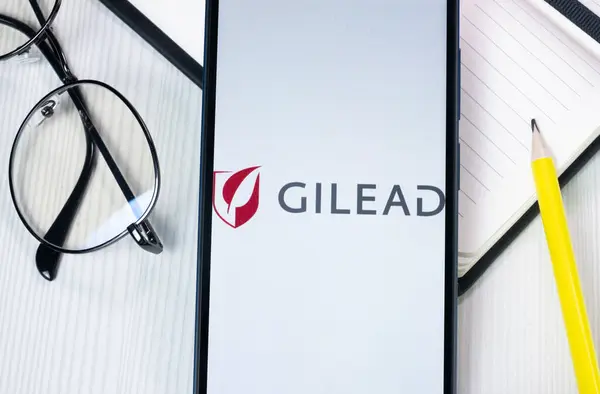 stock image New York, USA - 1 August 2024: Gilead Sciences Logo on Phone Screen, Company Icon on Display.