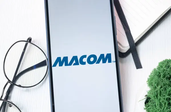 stock image New York, USA - 1 August 2024: MACOM Logo on Phone Screen, Company Icon on Display.