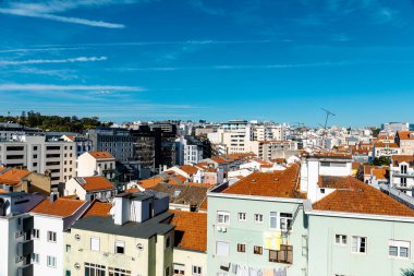 A plane flying in the sky of Lisbon, Portugal