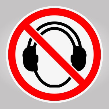 Bu resim, kalın kırmızı daire ve çapraz kesikle tasarlanmış kulaklıklara karşı açık bir yasaklama işareti içeriyor. Gürültü kısıtlamaları için görsel uyarı görevi görür..