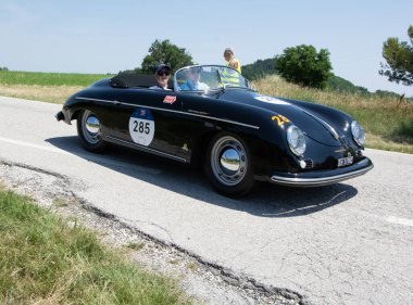URBINO, ITALY - JUN 16 - 2022 : PORSCHE 356 1500 SPEEDSTER 1955 on an old racing car in rally Mille Miglia 2022 the famous italian historical race