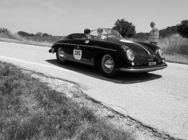 URBINO, ITALY - JUN 16 - 2022 : PORSCHE 356 1500 SPEEDSTER 1955 on an old racing car in rally Mille Miglia 2022 the famous italian historical race