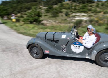 URBINO - ITALY - JUN 16 - 2022 : B.M.W. 328 1939 on an old racing car in rally Mille Miglia 2022 the famous italian historical race