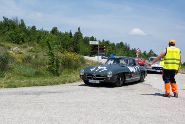 URBINO - ITALY - JUN 16 - 2022 : MERCEDES-BENZ 300 SL W198 1956 on an old racing car in rally Mille Miglia 2022 the famous italian historical race