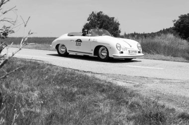 URBINO - ITALY - JUN 16 - 2022 : PORSCHE 356 1500 1954 on an old racing car in rally Mille Miglia 2022 the famous italian historical race