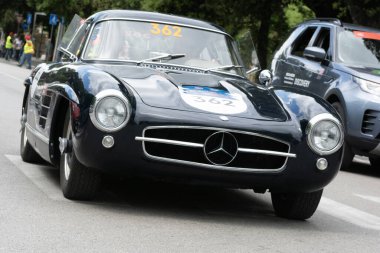 iTALY - 14 Haziran - 2023: MERCEDESBENZ 300 SL (W198) 1955old race car in rally Mille Miglia 2023 the famous Italian history race (1927-1957