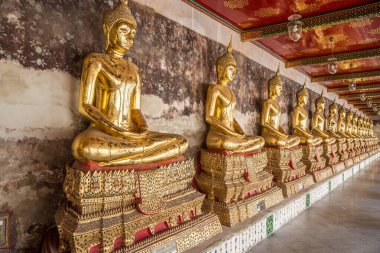 View at the Buddha statues in Wat Suthat Thepwararam Ratchaworamahawihan in Bangkok - Thailand