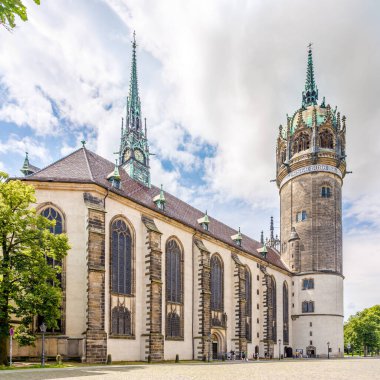 WITTENBERG,GERMANY - JULY 16,2024 - View at the Church of All Saints in the streets of Wittenberg. Wittenberg is the fourth-largest town in Saxony-Anhalt, Germany. clipart