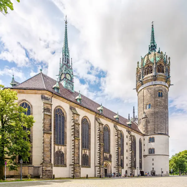 stock image WITTENBERG,GERMANY - JULY 16,2024 - View at the Church of All Saints in the streets of Wittenberg. Wittenberg is the fourth-largest town in Saxony-Anhalt, Germany.