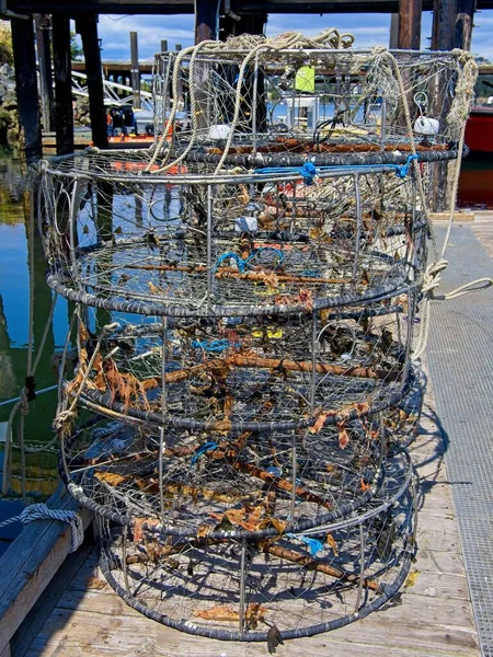 Commercial crap traps stacked on the dock, prepared for a fishing trip