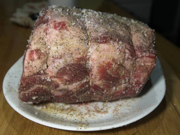 Beef prime rib roast in stages of preparation: