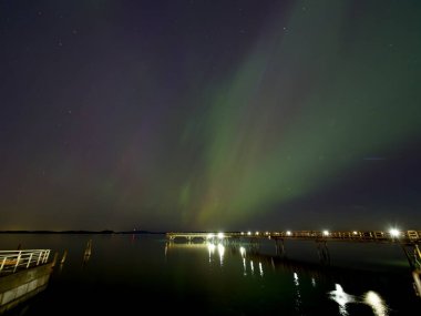 Aurora Borealis illuminates the sky over Sidney BC in rare intensive solar activity clipart