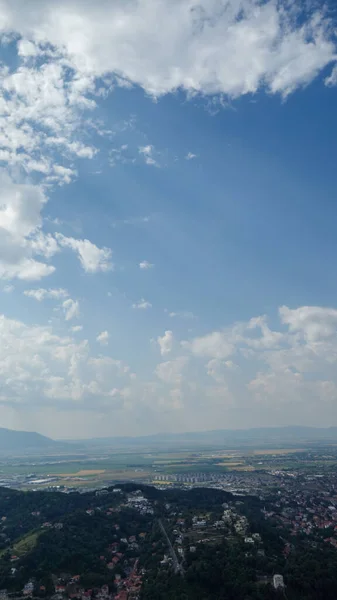 stock image a beautiful landscape with a cloudy sky and a city 