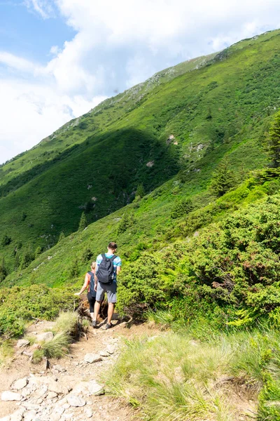 stock image tourists hiking on a trail in the mountains. carpathians, ukraine, ukraine, europe 