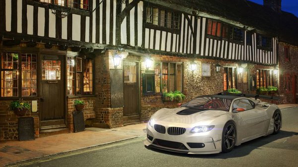 A sleek white sports car parked in a historic street at dusk, highlighting modern luxury against vintage architecture.