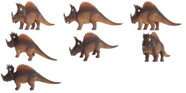 Çeşitli pozlarda oyuncak dinozorlar..
