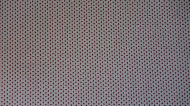 Kırmızı ve beyaz benek desenli tekstil tasarımı.