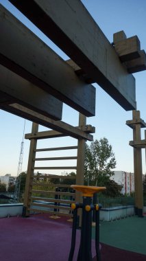 Outdoor playground with wooden climbing structure