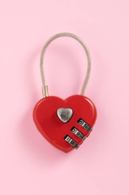 Valentine's Day design concept of beautiful red heart on pink background with copy space.