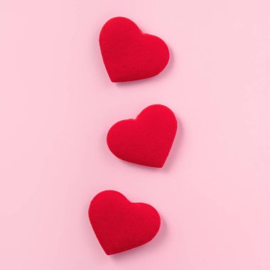 Valentine's Day design concept of beautiful red heart on pink background with copy space.