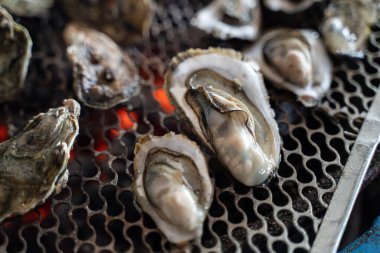 Grilled fresh oyster in Tainan, Taiwan, the famous Taiwanese street food gourmet.