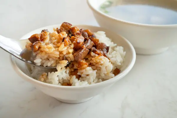 Braised meat rice, stewed pork over cooked rice in Taiwanese restaurant.