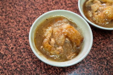 Taiwanese meatball - Delicious street food Bawan (Ba wan), steamed and deep fried starch wrapped round shaped dumpling with pork inside clipart