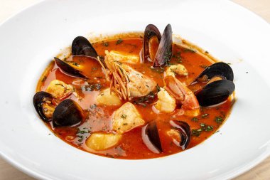 Spanish soup bouillabaisse with seafood, mussels, shrimps and scallop.