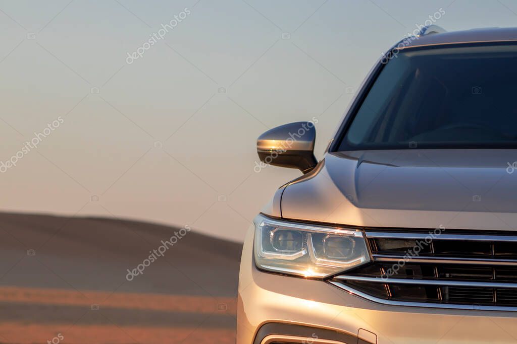 Volkswagen Tiguan allspace in the sand of the Namib desert against the bright sky. Walvis Bay, Namibia.