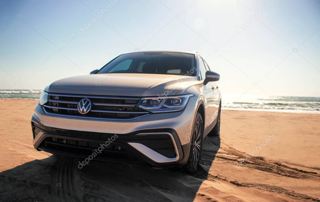 Volkswagen Tiguan allspace in the sands of the Namib Desert on the shores of the Atlantic Ocean on a sunny day
