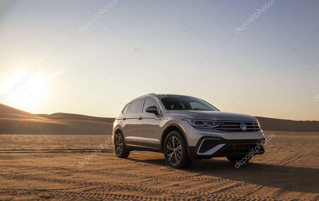 Volkswagen Tiguan allspace in the sand of the Namib desert at sunset