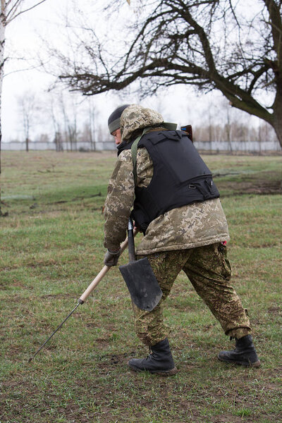 Berezivka, UKRAINE - APRIL 21, 2022: War of Russia against Ukraine. Ukrainian sappers clear the territory after it was occupied by the Russian military, APRIL 21, 2022.